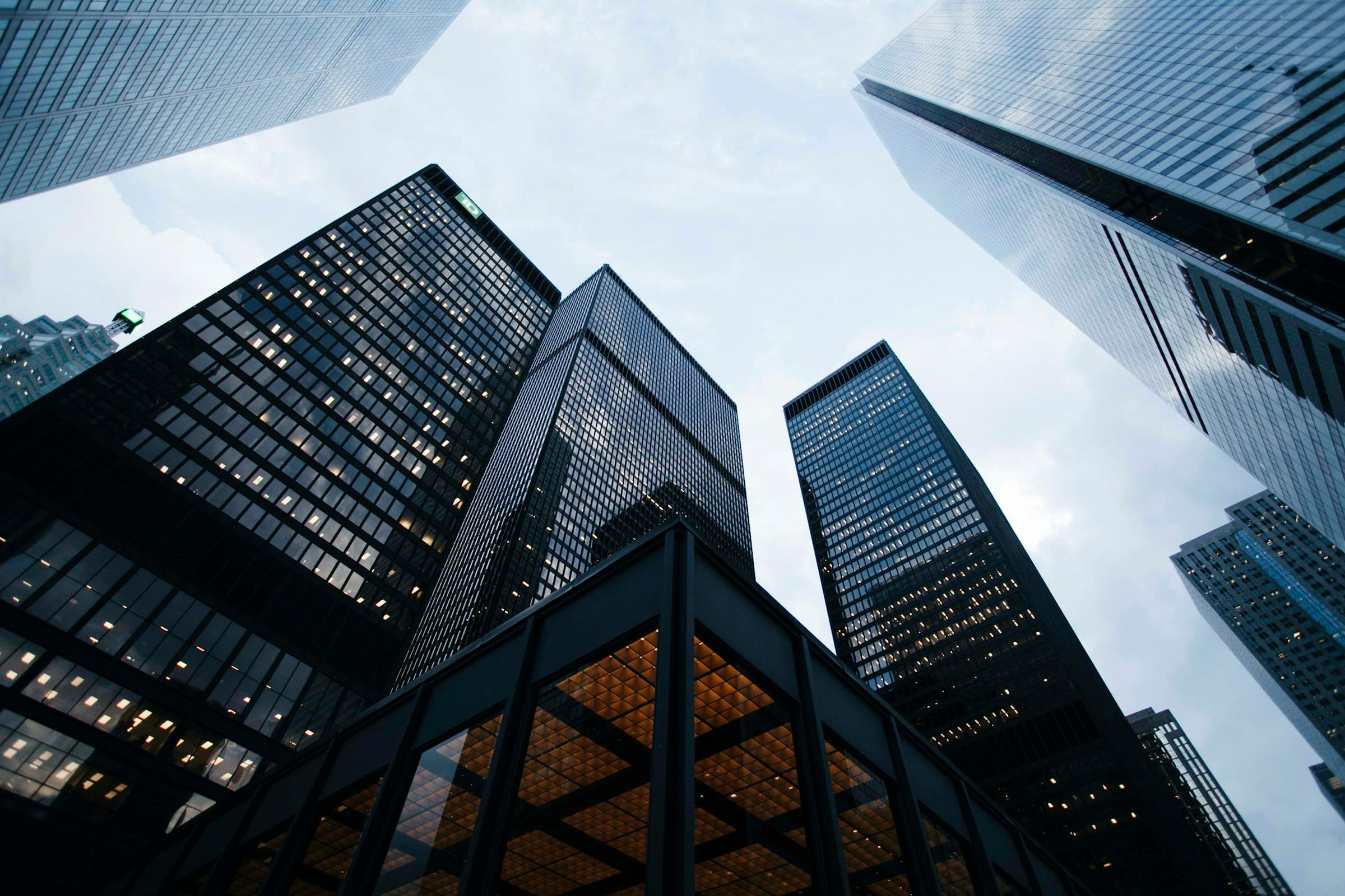 Modern commercial buildings rising against an overcast sky